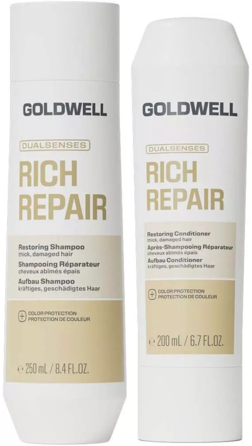 Två vita flaskor med Goldwell Rich Repair hårprodukter, en restoring schampo och en restoring balsam, med guld- och svart text.