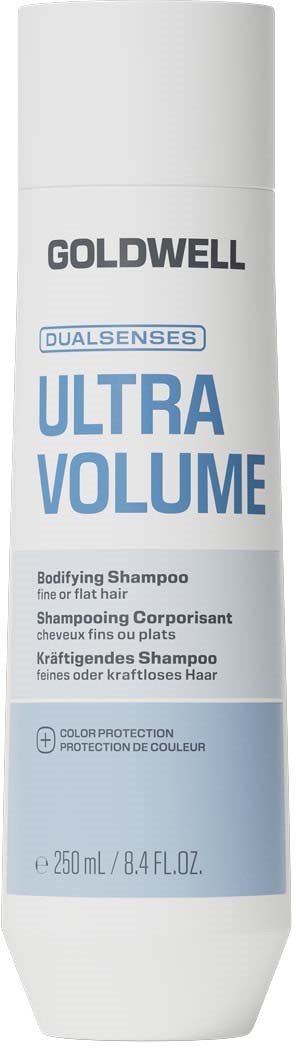 En vit flaska med Goldwell Ultra Volume schampo med blå och svart text, 250 ml storlek.