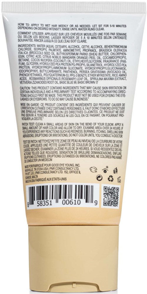 Een persoon brengt beige crÈme of lotion aan op hun hand, met een tube met klapdop.