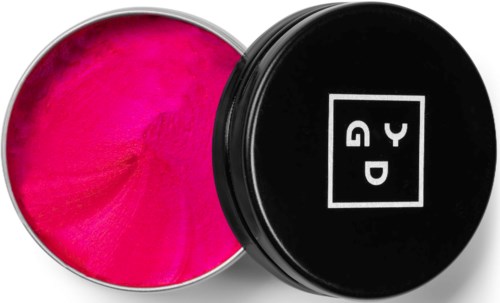 A round container with bright pink substance, black lid with a logo, partly open to show the color inside.