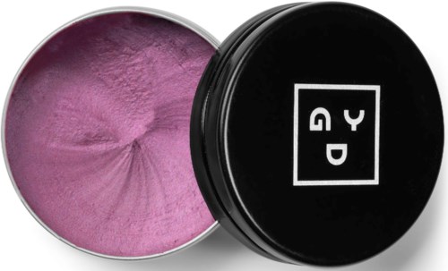 Pink powder inside a round container with a black lid that has a white logo and text.