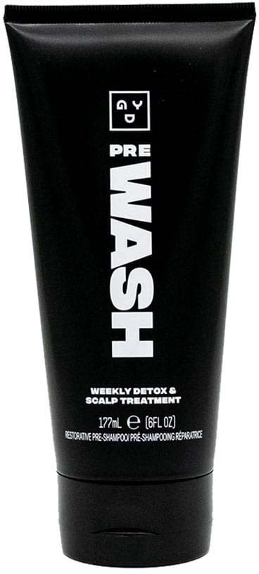 Black tube of shampoo with bold white and gray text, indicating detox and scalp treatment for hair.