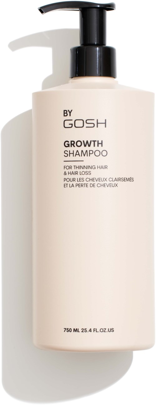 Yksinkertainen valkoinen shampoopullo mustalla pumpulla, merkitty "BY GOSH GROWTH SHAMPOO".