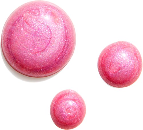 Three pink glossy spheres with a shiny, glittery surface on a white background.