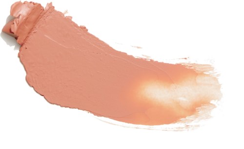 En kladd av rosa/beige smink eller foundation på en vit bakgrund.