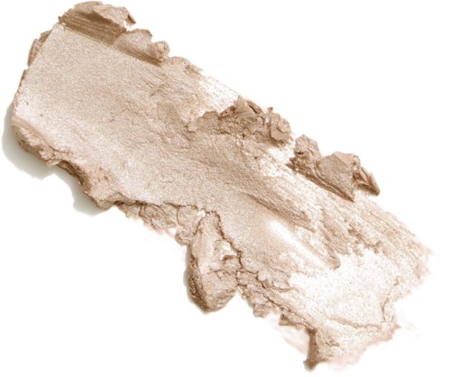 Ett trasigt, smulat beige pulver utspritt på en vit bakgrund.