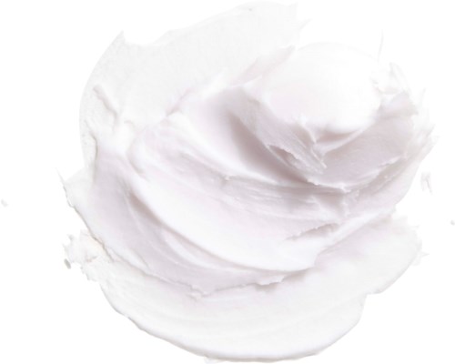 Mjuk vit kräm eller mousse med slät, virvlad yta. Ser ut som en klick, kanske för dessert eller hudvård.