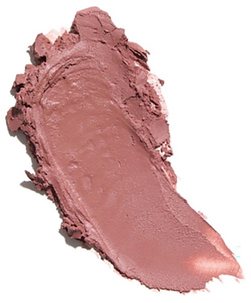 Pink makeup blush in a smudged shape on a white background.