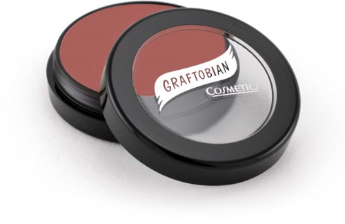 Round makeup blush with a clear lid and black frame, labeled 'Graftobian Cosmetic.'