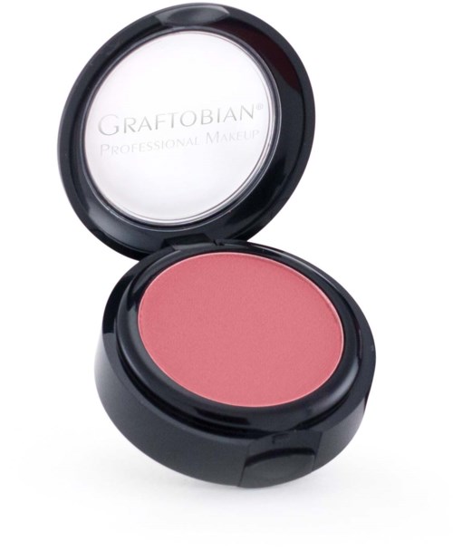 A round, black makeup compact with pink blush inside and a mirror on the lid.