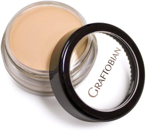 Et åbent krukke med beige creme og sort låg mærket 'CRAFTBIAN' vises.