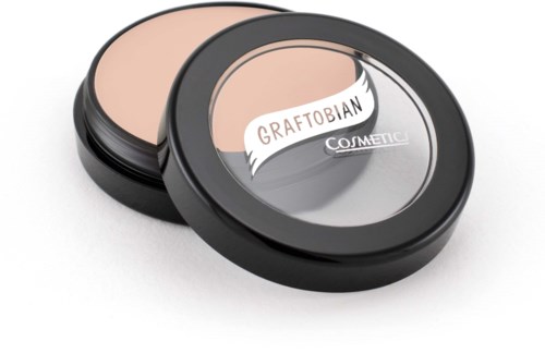 Two round makeup compacts, one open showing powder inside, and one closed with a brand label.