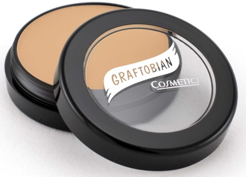 A round container with beige face powder and a mirror, labeled 'Graftobian Cosmetic' on the lid.