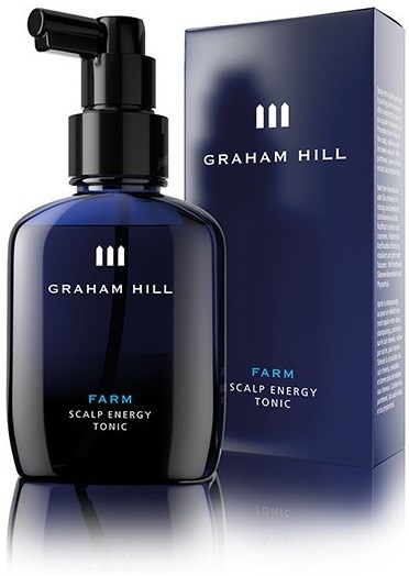 En mørk blå flaske med pumpe, merket Graham Hill Farm Scalp Energy Tonic, og dens matchende eske.