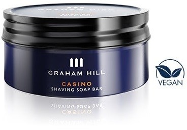 Granatowa puszka z czarnym wieczkiem, z napisem 'GRAHAM HILL CASINO SHAVING SOAP BAR' i logo wegańskie.