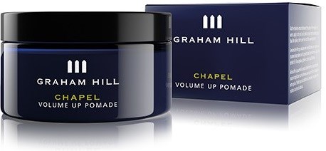 En mörkblå burk och förpackning med vit och gul text, märkt Graham Hill Chapel Volume Up Pomade.