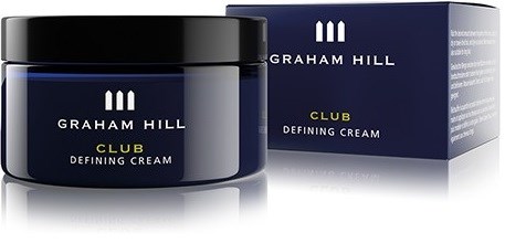 En mørk blå krukke og æske af Graham Hill Club Defining Cream med guld- og hvid tekst.
