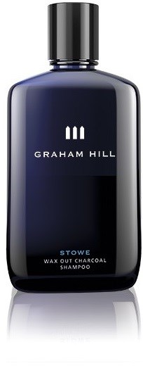 Mörkblå flaska av Graham Hill Stowe vax ut kol i schampo med svart lock.
