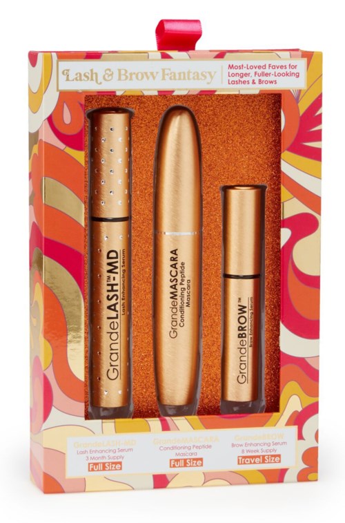 A boxed lash and brow kit with three tubes, colorful floral packaging, labeled for full and travel size.
