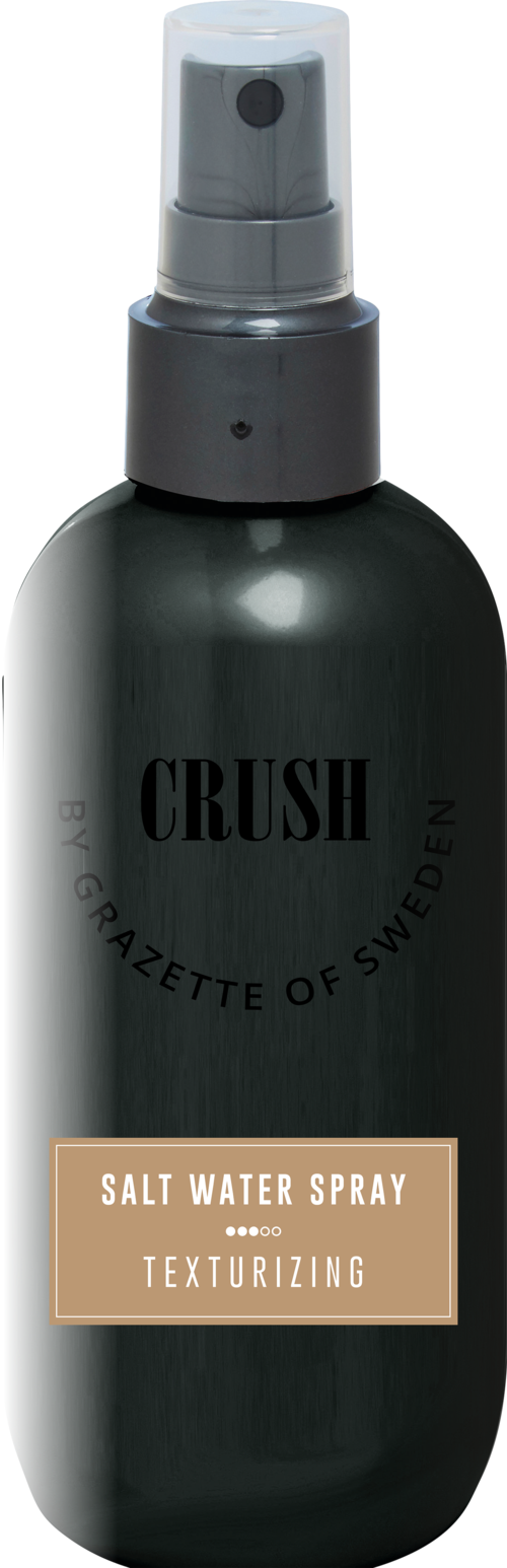 A black spray bottle labeled 'Salt Water Spray' for texturizing hair.