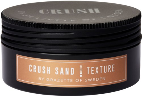 En svart behållare med Crush Sand Texture hårprodukt från Sverige, med lock och etikett som beskriver produkten.
