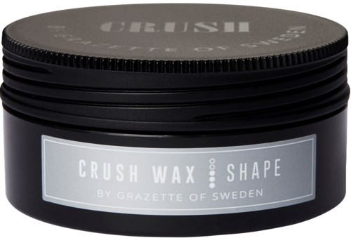 Svart behållare av hårvax märkt 'CRUSH WAX SHAPE by GRAZETTE OF SWEDEN' med skruvkork.