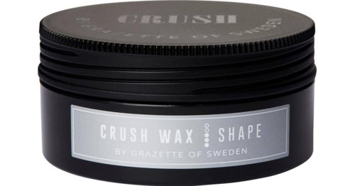 En svart behållare med lock, märkt "CRUSH WAX SHAPE" av Gazette of Sweden.