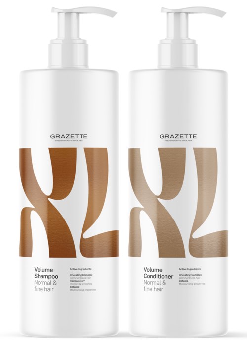 Two white bottles, one for shampoo and one for conditioner, with large brown and beige lettering, and a pump top.