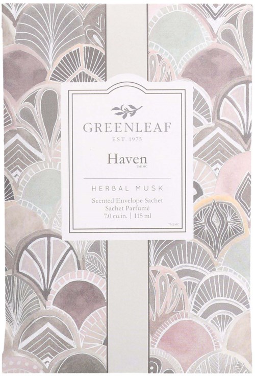 Koristeellinen pakkaus, jossa pastellinväriset lehtikuviot ja valkoinen etiketti, jossa lukee 'Greenleaf Haven Herbal Musk' ja muita tietoja.