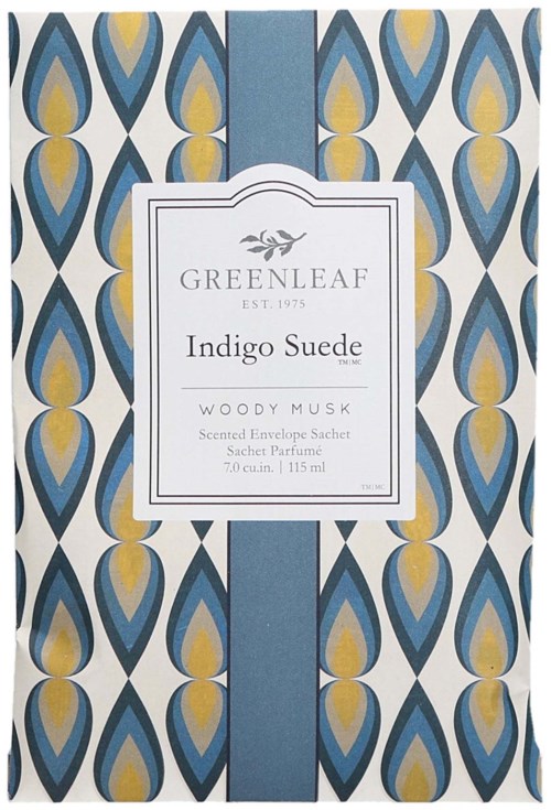 En dekorativ box med blå och guld droppmönster, etikett i mitten för Greenleaf Indigo Suede doftpåse.