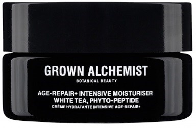 En svart burk med en etikett för Grown Alchemist ansiktskräm som nämner att den är för åldersreparation med vitt te och peptider.