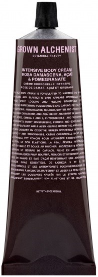 En mörk tub med kroppsskräm och svart lock, märkt 'Grown Alchemist'. Den har detaljerad text om ingredienser och användning.