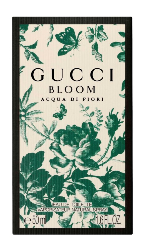 Pudełko perfum z zielonymi kwiatami i motylami, tekst 'Gucci Bloom Acqua di Fiori' i informacje o rozmiarze.