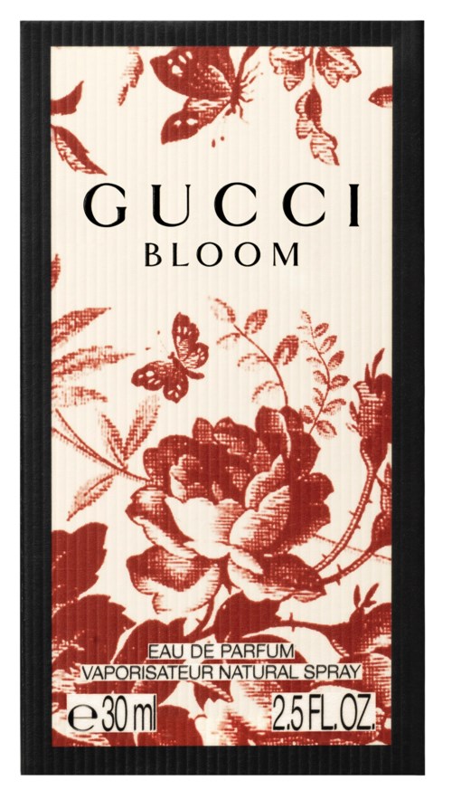 Hajuvesipullo, jossa kukkakuva, nimi Gucci Bloom, jaettavaksi määräksi ja suihkukuvaksi.