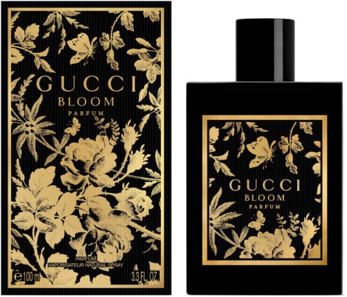 A black perfume bottle and box with gold floral and butterfly designs, labeled 'Gucci Bloom Parfum'.