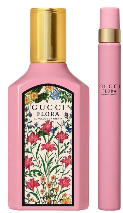 A pink bottle with a gold cap and a pink roller, featuring a floral design labeled 'GUCCI FLORA'.