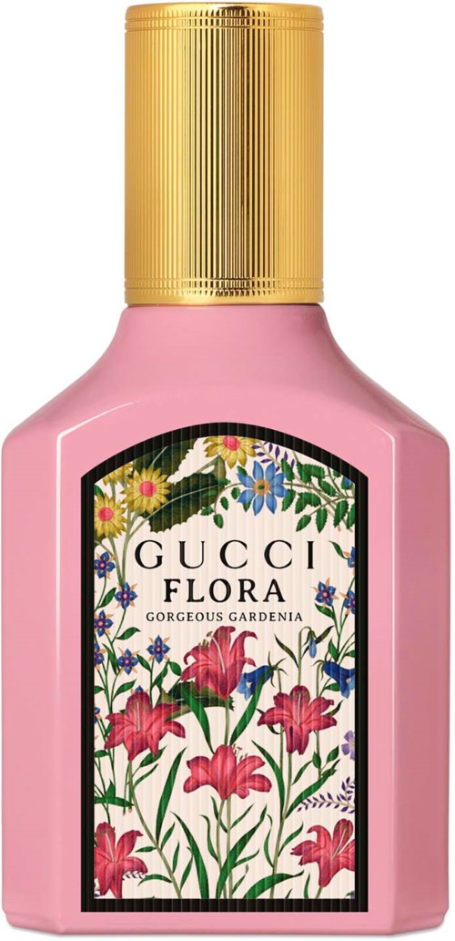 En rosa parfymflaska med guldlock, märkt Gucci Flora Gorgeous Gardenia, dekorerad med färgglada blommor.