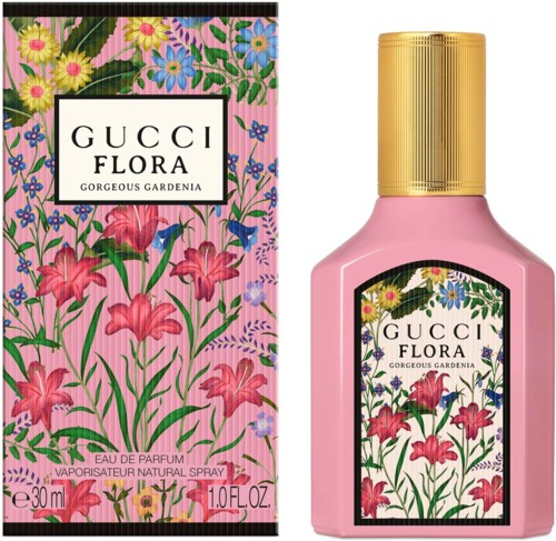 Blommig parfymflaska och förpackning med rosa, gula, lila och blå blommor och gröna blad.