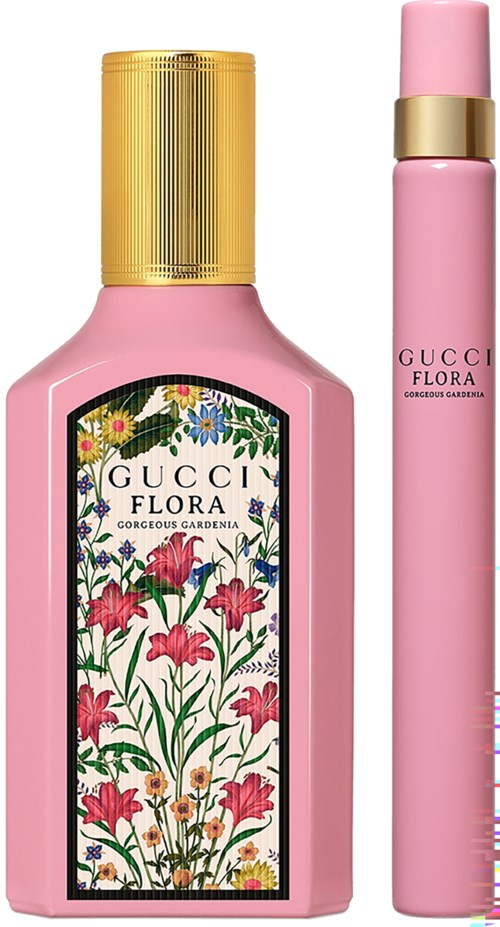 En rosa flaska märkt 'Gucci Flora' med blommönster och spraypinne.