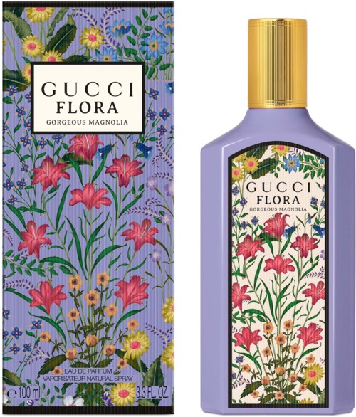 En flaske Gucci Flora parfume med blomsterdesign, lilla farve, guldkrone og matchende æske.