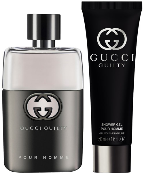 En flaska och en tub med Gucci Guilty Pour Homme duschgel, svart och silver färger, minimalistisk design.