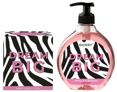 En rosa flytande tvålflaska och en box med pappersnäsdukar med zebramönster och rosa text. Båda säger "Dream Big."