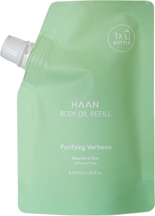 A green refill pouch for body oil, labeled as natural, silicone-free, and containing 100ml of product.
