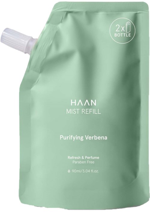 A green refill pouch labeled 'Haan Mist Refill' with a white spout, containing purifying verbena spray, paraben free.