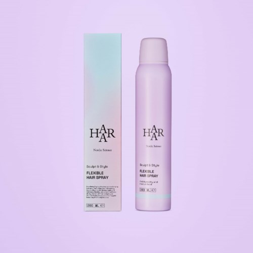 Lila pullo ja sen rasia, jossa lukee 'Flexible Hair Spray,' minimalistinen pastellitausta.