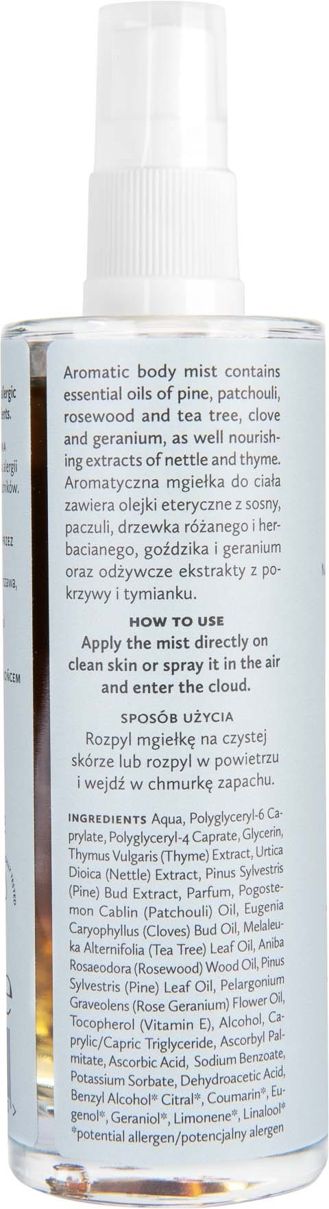 A clear spray bottle of aromatic body mist with a white spray cap, featuring a detailed label with usage instructions and ingredients.