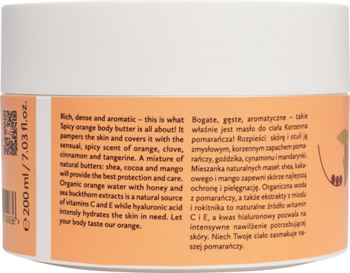 En kroppssmørboks med etikk som beskriver appelsinlukt, ingredienser som shea, mango og honning.