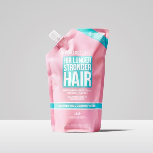 Pink shampoo pouch with blue and white text promoting longer, stronger hair.