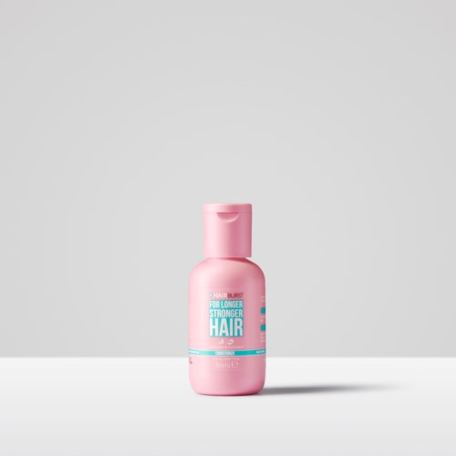 Pink bottle of hair product with blue and white label, text highlights longer, stronger hair benefits.
