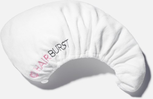 A white sleep mask with pink and black text reading "NAIR BURST" and a logo, shaped to cover eyes.